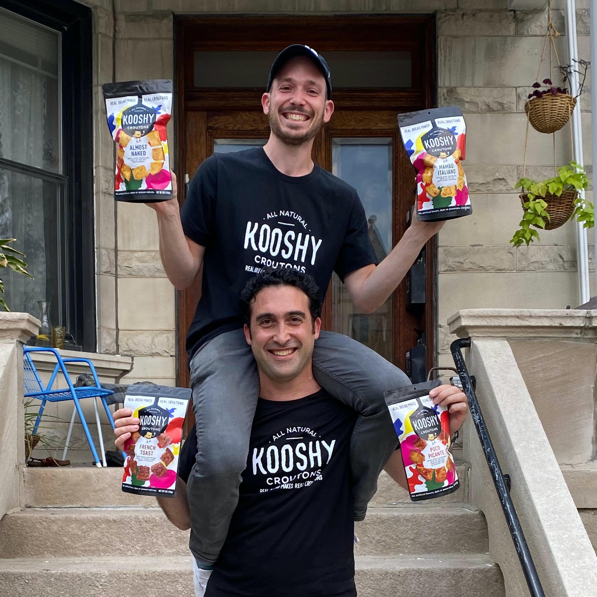 image shows brother founders as adults with matt sitting on jon's shoulders.