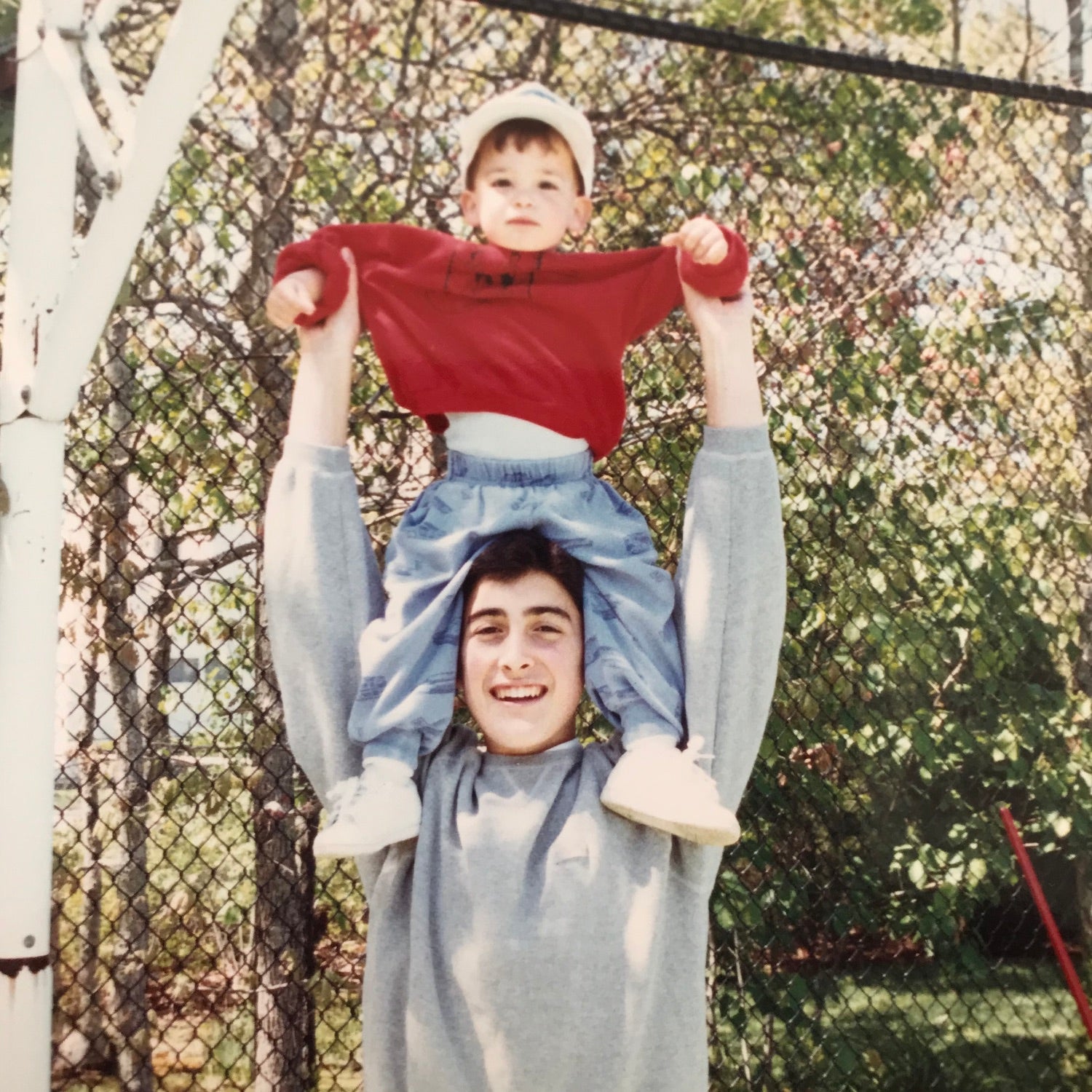 image shows brother founders as children with young matt sitting on jon's shoulders.