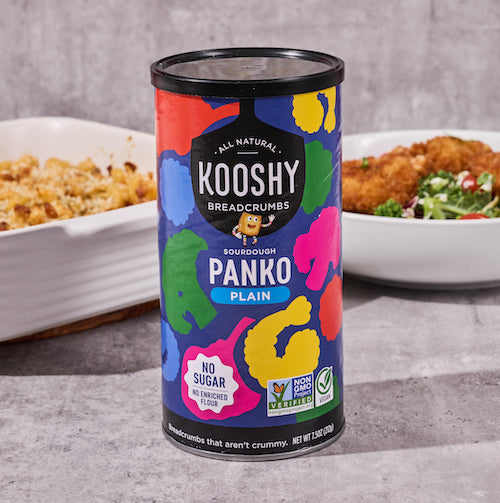 Can of plain panko breadcrumbs with bowl of fried shrimp in the background.