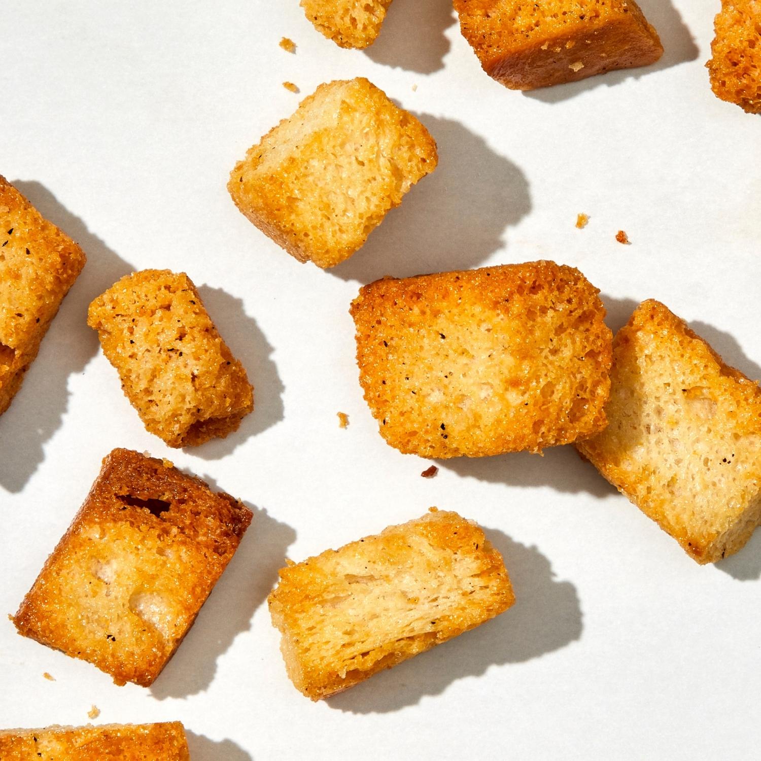 Detailed photo of Almost Naked flavor of croutons showing the seasoning and oven browning.